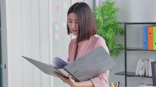 Young Asian business woman in office face portrait smile happy.
