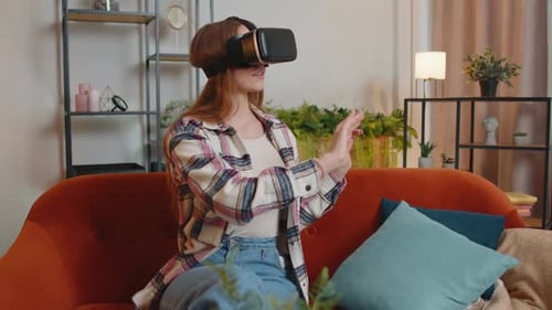 Young Woman Experiences Virtual Reality in Living Room