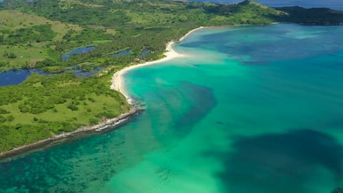 A Tropical Island with a Turquoise Lagoon and a Sandbank. Caramoan Islands, Philippines.