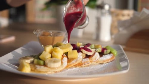 Fruit Pancakes Topped with Sweet Berry Sauce, Close Up