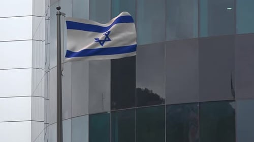 Realistic Flag of Israel Waving Outside Corporate Building