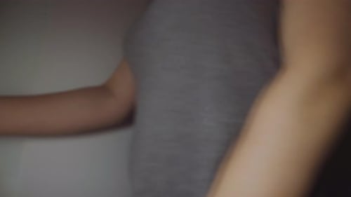 Hand Turns Modern Silver Door Handle to Open Door