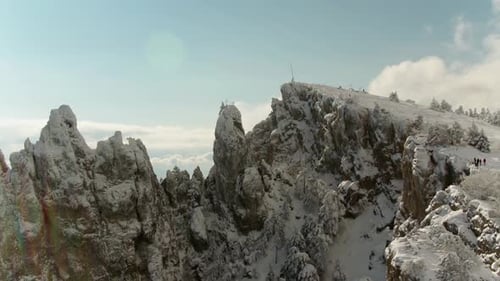Top Of Mountain Under Snow And Blue Sky