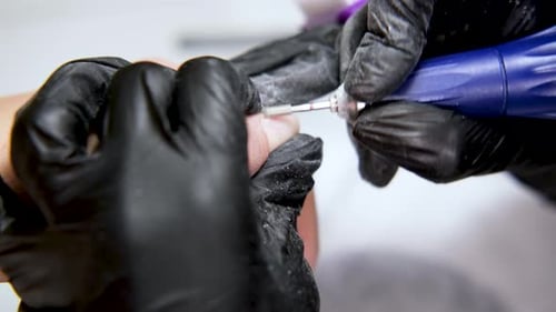 Close Up of Manicure Treatment with Electric File