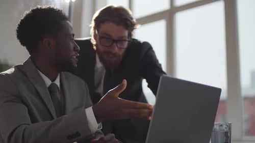Office Colleagues Fist-Bump After Successful Collaboration