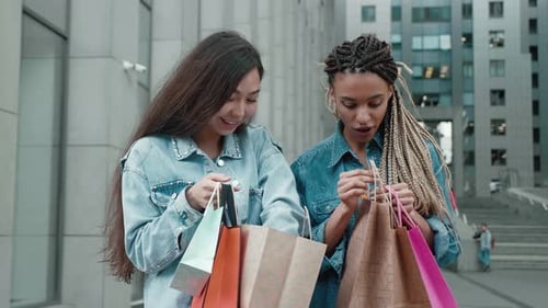 Women Excited About Shopping Purchases in City