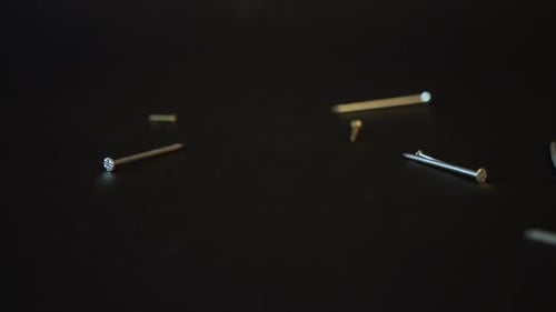 Nails falling on black background Sony a6300 100fps