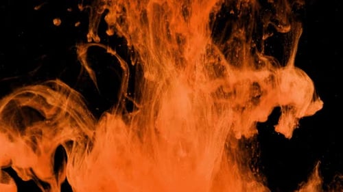 Abstract Orange Ink Swirling on Black Background