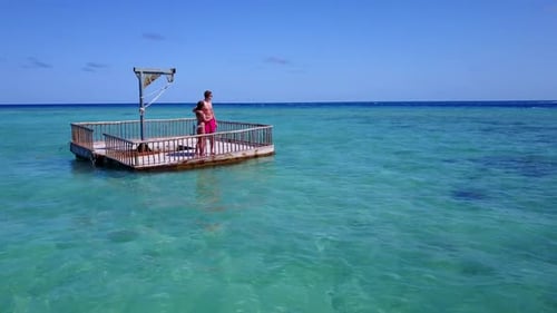 Boy and girl in love on luxury bay beach wildlife by aqua blue sea with white sandy background of th