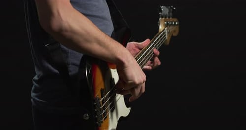 Man strumming an electric guitar