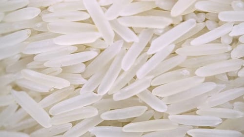 Rotating Raw Rice Closeup Vegetarian Healthy Eating Product.
