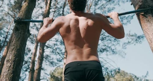 Strong Man Performing Exercises on the Uneven Bars, Sport and Healthy Lifestyle. Close Up of Strong