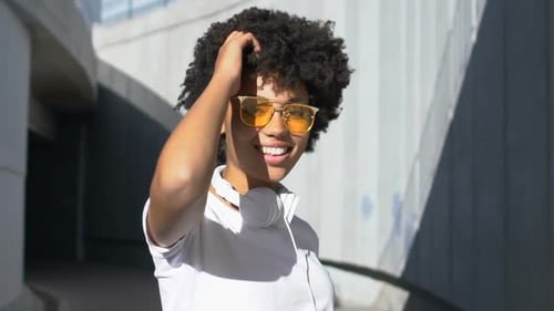 Attractive Woman Smiling and Posing in Urban Setting