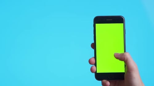 Woman Hand Holding a Black Smartphone with Green Screen and Touching or Press Display, Man Using