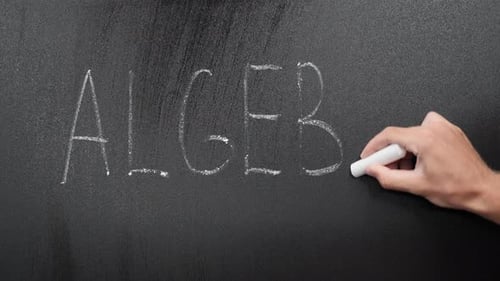 Hand Writes Word Algebra on Chalkboard