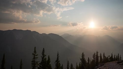 Mountains Landscape at Golden Hour with Sun and Haze