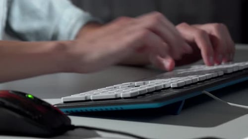 Cropped Shot of a Man Typing on Computer Keyboard