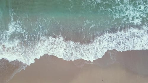 High and powerful waves coming fast to the beach, waves in winter day