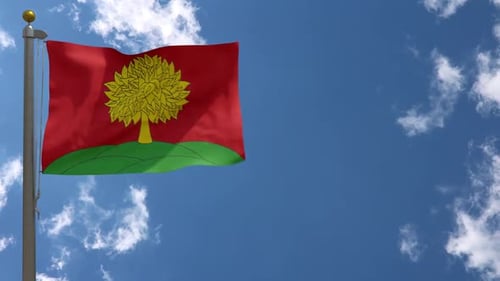 Vibrant Flag with Yellow Tree Waving on Green Hills Against Blue Sky