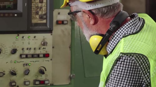 Smart Factory Worker Using Machine in Factory Workshop