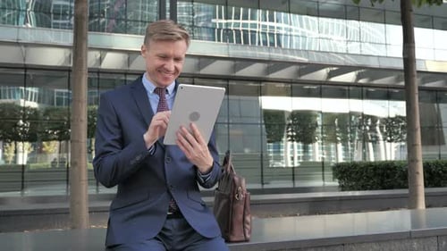 Businessman Using Tablet