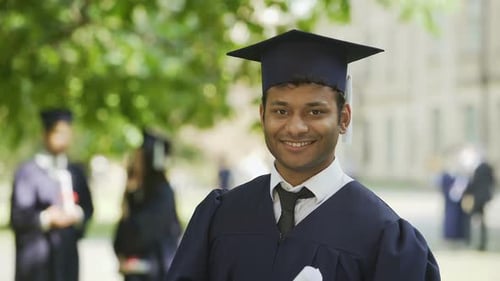 Smiling Hispanic Graduate Student Rejoicing Diploma, Success, Posing for Camera