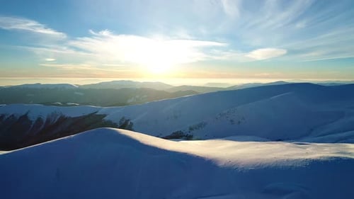 Snowy Mountains Landscape at Golden Sunrise