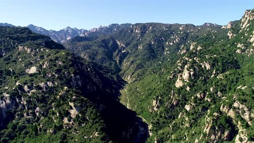 Aerial View of Green Mountain Mountain Peak with Beautiful Blue Sky.