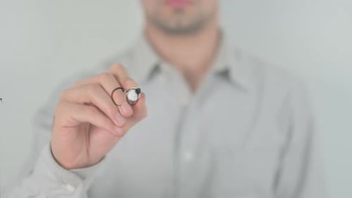Man Writes Consulting on Glass with Marker