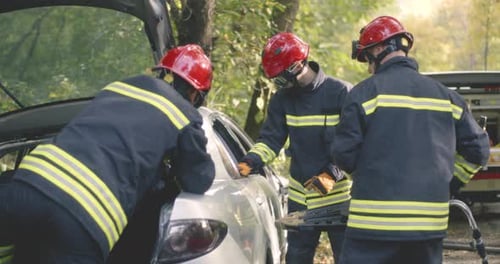 Firefighters Rescue Person From Damaged Vehicle