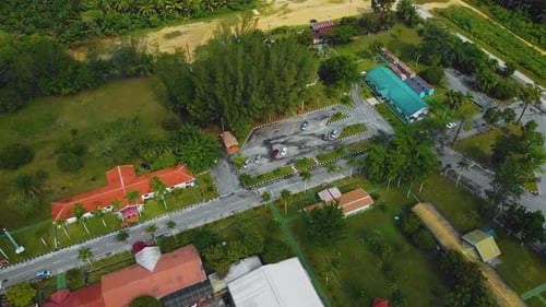 Cinematic Drone Footage of Palm Oil Mill Effluent residential consists of buildings, homes, main roa