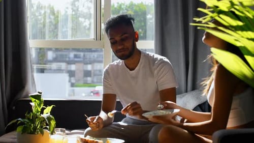 Couple Feeding Each Other Breakfast in Bright Apartment