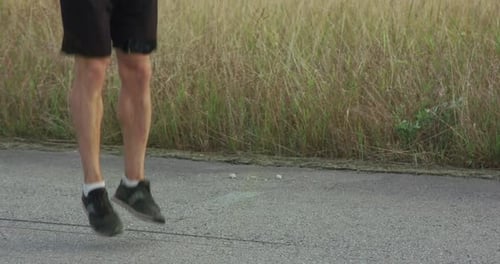 Young Man Jumps Rope for Fitness Outdoors