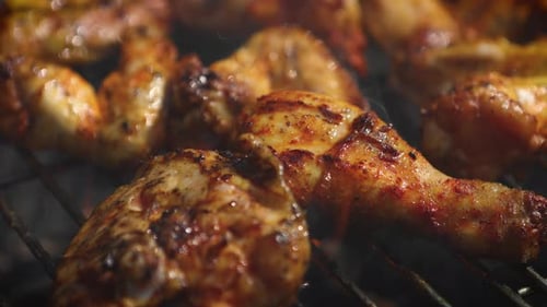 Delicious Chicken Pieces Frying on Barbecue Grill