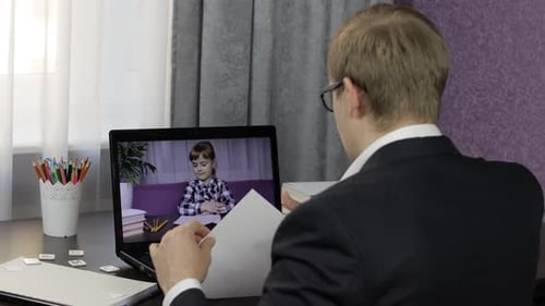 Man Talks to Child During Virtual Call