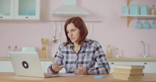 Young Adult Woman Talking Online By Video Call Working From Home. Remote Home Office. 30s Business