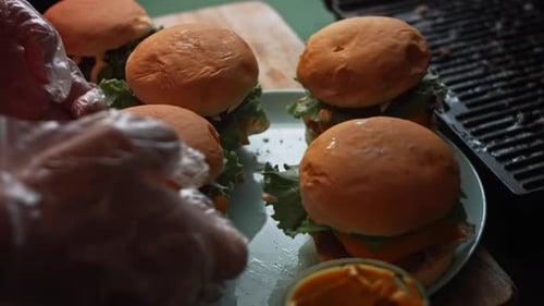 Burgers Being Prepared and Stacked Together