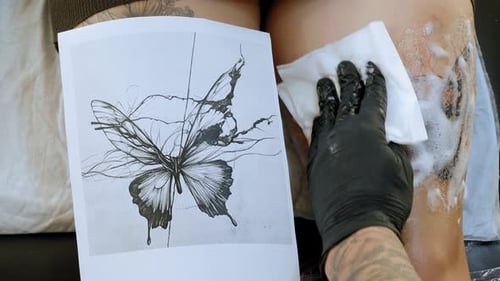 Tattoo Artist Cleans Off New Butterfly Tattoo