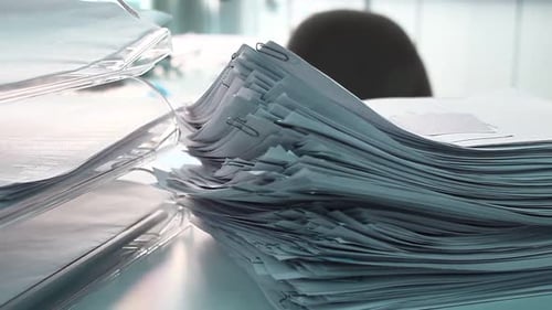 Stack of Documents and Paperwork in an Office
