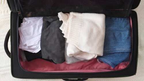 Packing A Luggage For A New Journey. Timelapse.