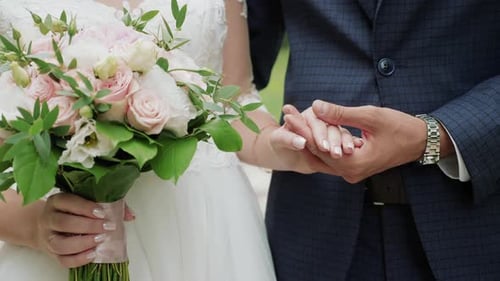 Newly Married Couple Holding Hands Close-up