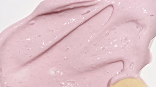 Pink Cream Spreading with Wooden Stick