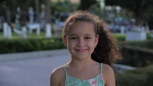 Smiling Girl With Curly Hair Close Up