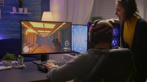 Man and Woman Play Video Game Together