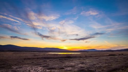 View of the Sunset Sky with Clouds Over the Balkan Mountains and the Black Sea Bay Near the Beach