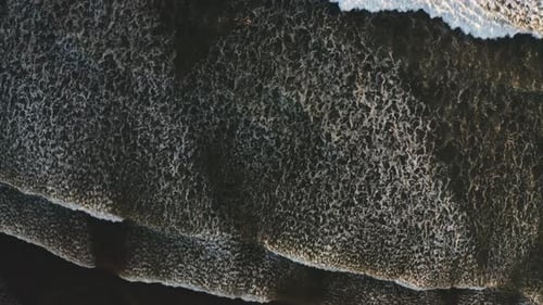 Drone view of waves and shoreline