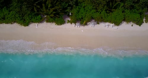 Beautiful drone copy space shot of a summer white paradise sand beach and blue ocean background in b