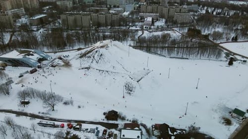 Suburb of a big city. City block from the height of the flight. City slide for skiing.