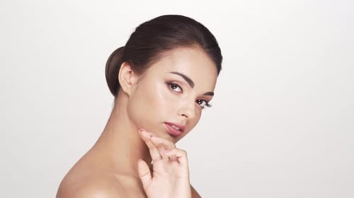 Studio portrait of young and beautiful brunette woman over