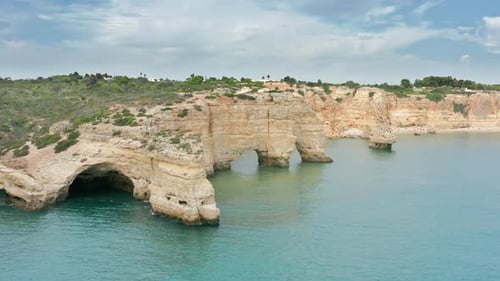 Aerial View of Small Caves on a Side of Rock Formation